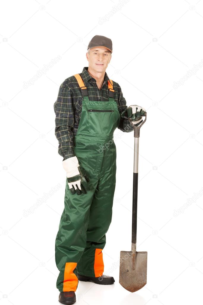 Mature gardener with a spade