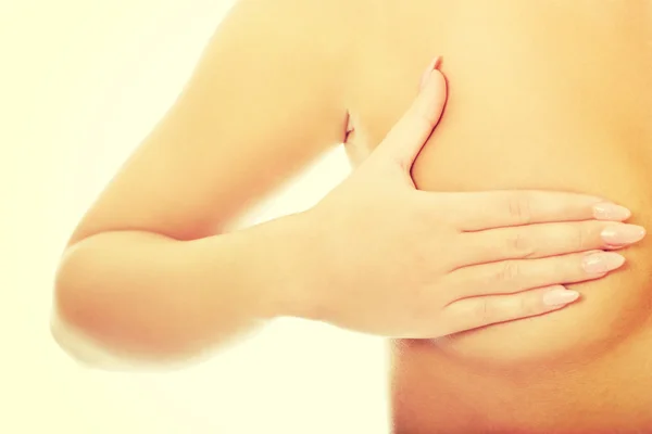 Woman examining breast. — Stock Photo, Image