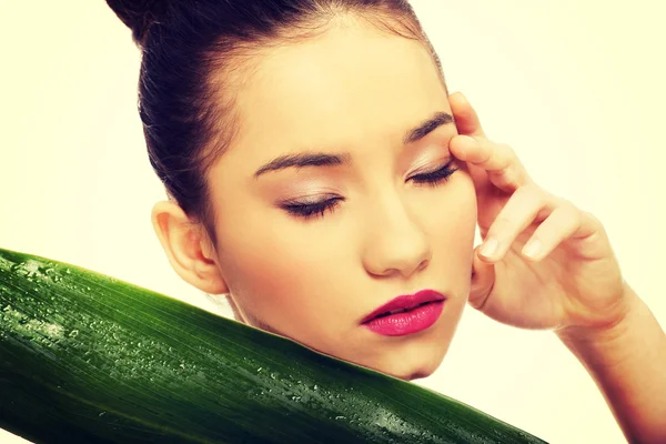 Beautiful woman with green leaf. — Stock Photo, Image