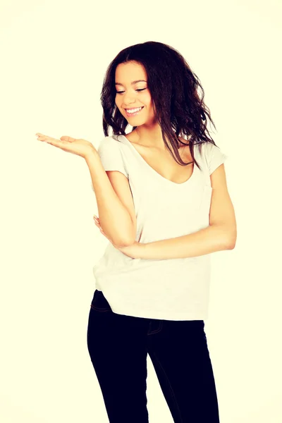 Woman holding something on palm. — Stock Photo, Image