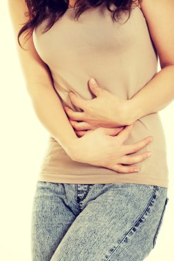 Kadının karnı içinde şiddetli ağrı acı.