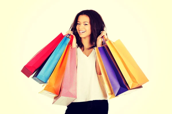 Gelukkig lachende vrouw met shopping tassen. — Stockfoto