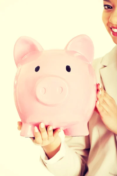 Business woman with a piggybank. — Stock Photo, Image