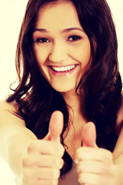 Young woman showing thumbs up. — Stock Photo, Image