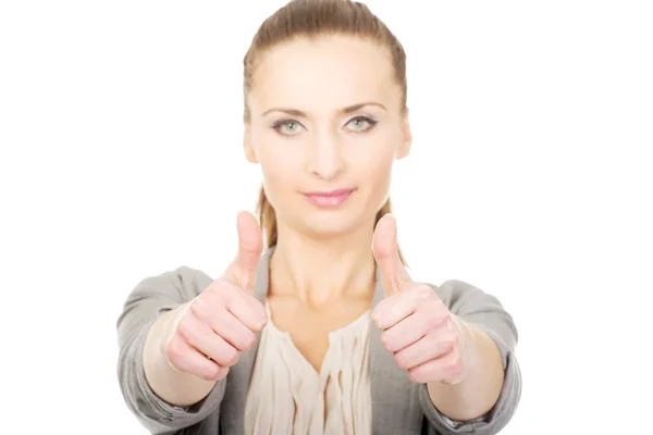 Smiling businesswoman with thumbs up. — Stock Photo, Image