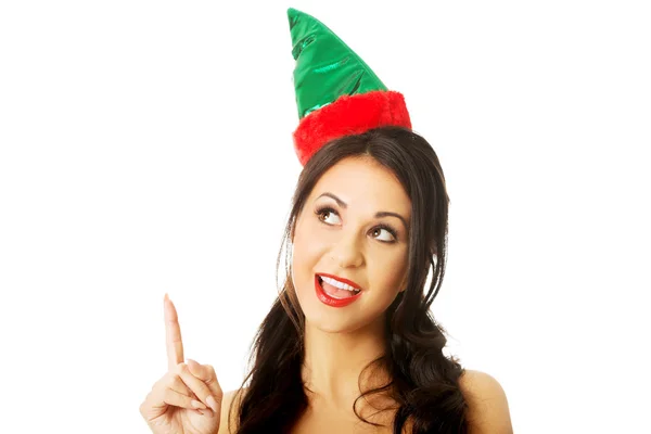 Portrait of woman wearing elf clothes pointing up — Stock Photo, Image