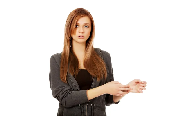 Teenage woman holding her wrist - pain concept — Stock Photo, Image