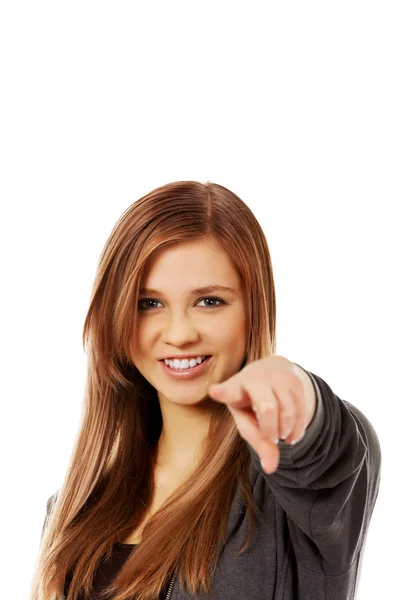 Beautiful teenage woman pointing at camera — Stock Photo, Image