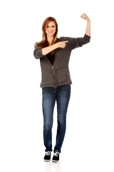 Funny woman showing her muscles — Stock Photo, Image