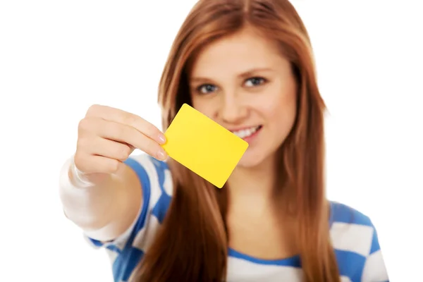 Teenage woman holding empty business card — Stock Photo, Image