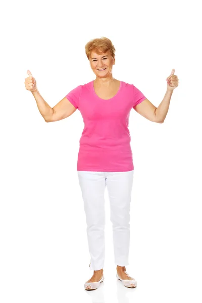 An old smilig woman with thumbs up — Stock Photo, Image