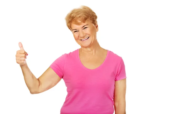 An old smilig woman with thumb up — Stock Photo, Image