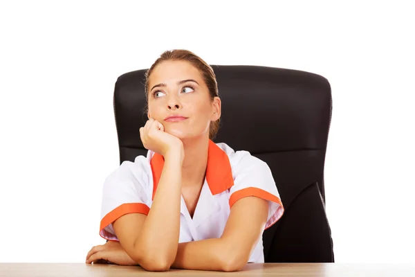 Tired young female doctor — Stock Photo, Image