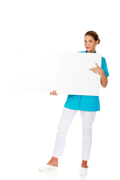 Doctor holding empty banner — Stock Photo, Image