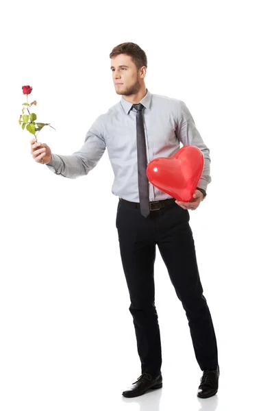 Man with red rose and heart balloon — Stock Photo, Image