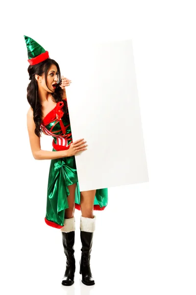 Kobieta ubrana elf ubrania trzymając transparent — Zdjęcie stockowe