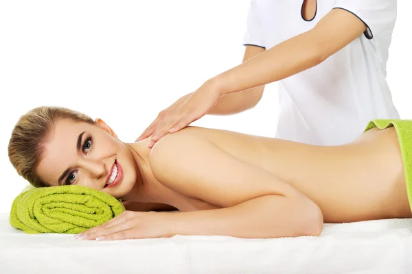 Young smile woman lying on a massage table and has massage. — Stock Photo, Image