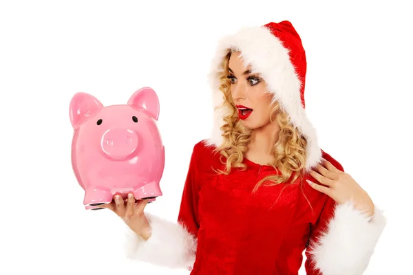 Surpreendido santa mulher segurando piggybank — Fotografia de Stock