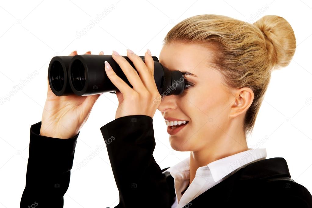 Young businesswoman with a binocular