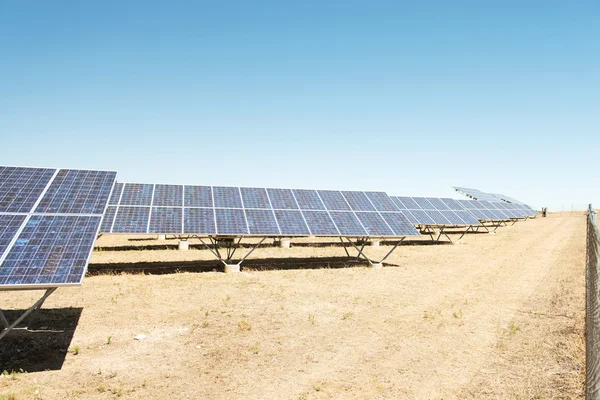 Panels of solar power station on the field — Stock Photo, Image