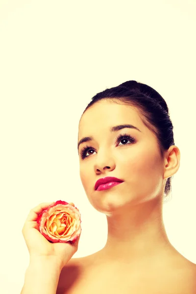 Beautiful woman with pink rose. — Stock Photo, Image