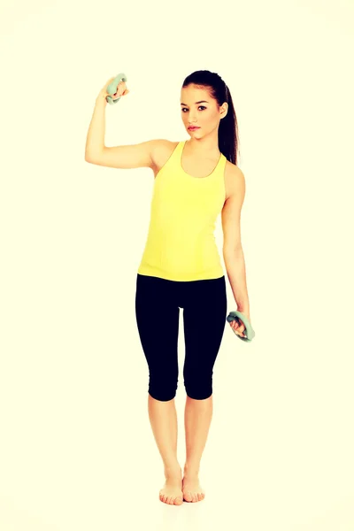 Active woman holding weights. — Stock Photo, Image
