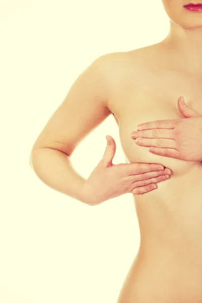 Woman examining breast — Stock Photo, Image