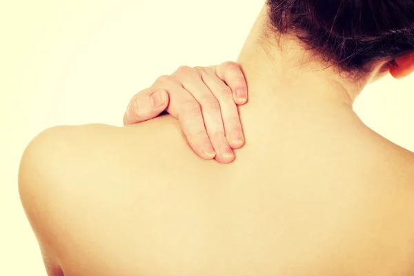 Mulher segurando pescoço — Fotografia de Stock