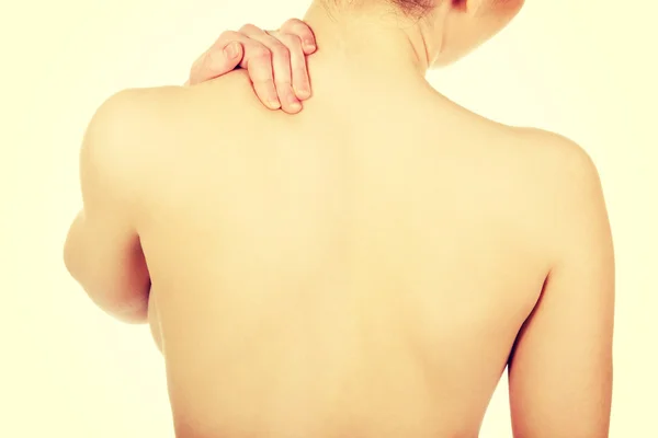 Woman holding neck — Stock Photo, Image