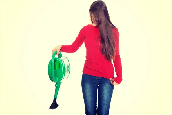 Frau hält Gießkanne in der Hand. — Stockfoto