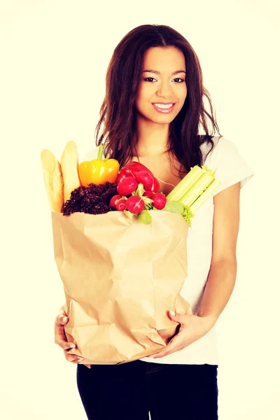 Young woman with grocery and vegetables. — Stock Photo, Image