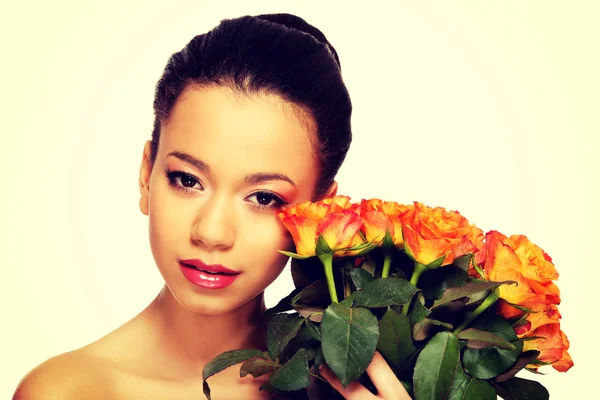 Beauty african woman with roses. — Stock Photo, Image