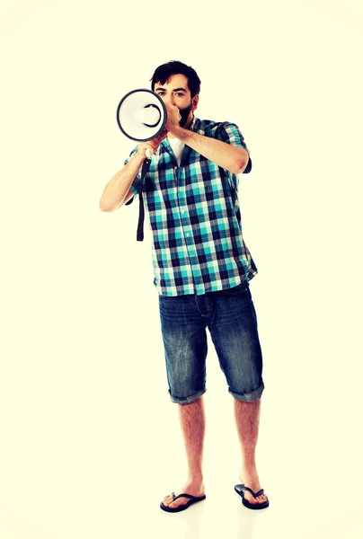 Young man shouting through megaphone. — Stock Photo, Image