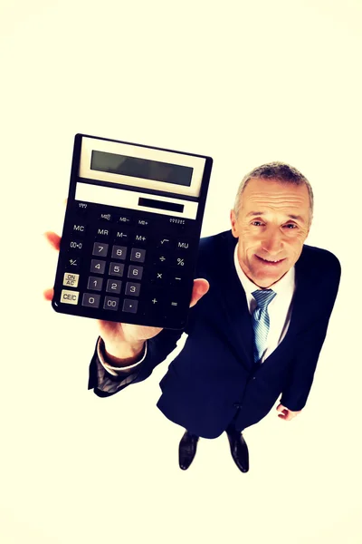 Happy businessman holding a calculator — Stock Photo, Image