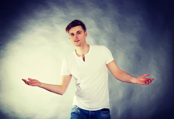 Young man with open hands. — Stock Photo, Image