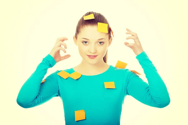 Young woman covered with post it notes. — Stock Photo, Image