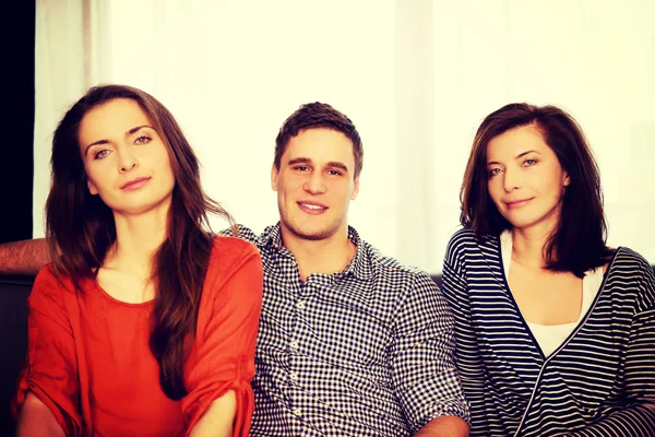 Sisters and brother relaxing at home. — Stock Photo, Image