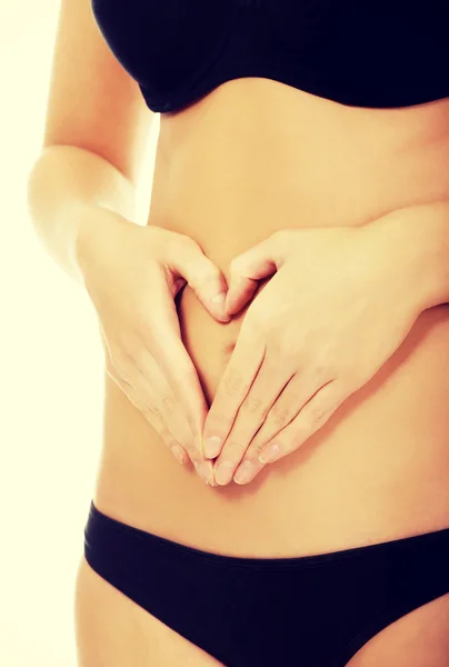 Mulher com as mãos na barriga . — Fotografia de Stock