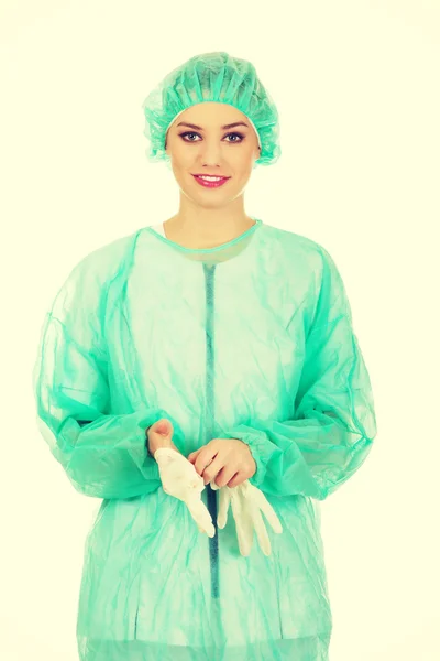 Woman doctor wearing medical gloves. — Stock Photo, Image