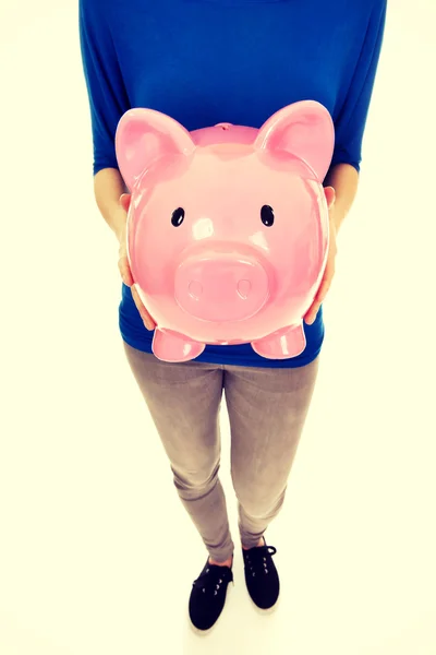 Woman holding piggybank. — Stock Photo, Image