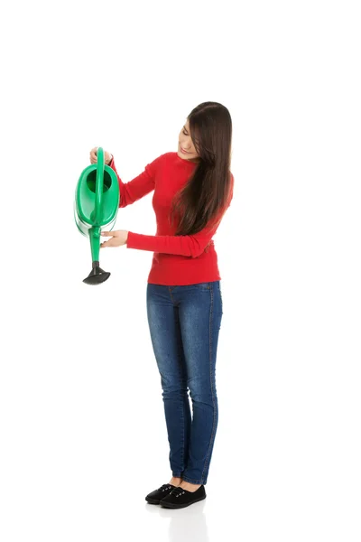 Woman holding a watering can. — Stock Photo, Image