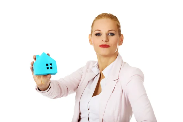 Smile business woman holding a paper house — Stock Photo, Image