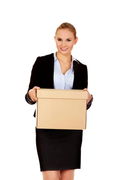 Business woman holding cardboard box — Stock Photo, Image