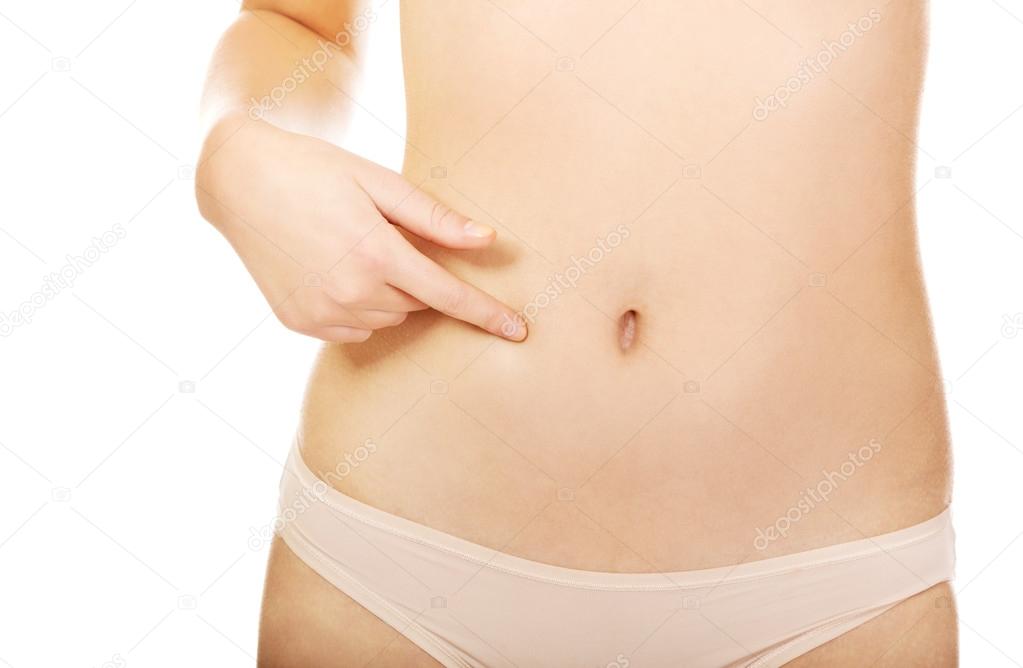 Young woman pointing for her belly