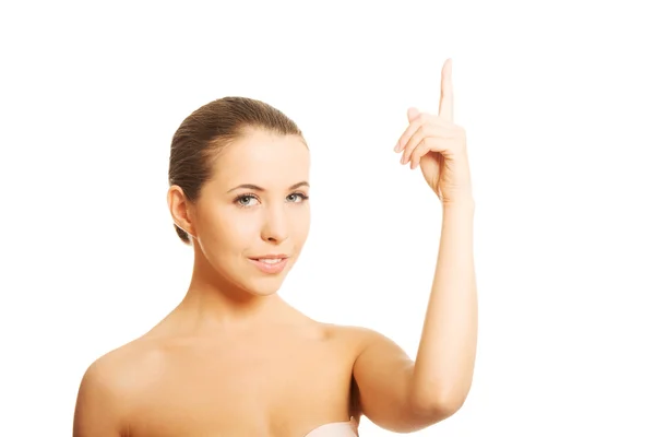 Nude woman pointing up — Stock Photo, Image