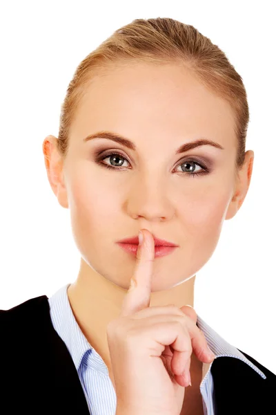 Business woman making silent sign with finger on lips — Stock Photo, Image