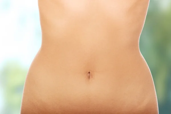 Womans slim belly. — Stock Photo, Image