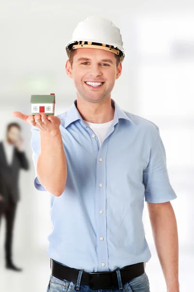 A forewoman holding a model house — Stock Photo, Image