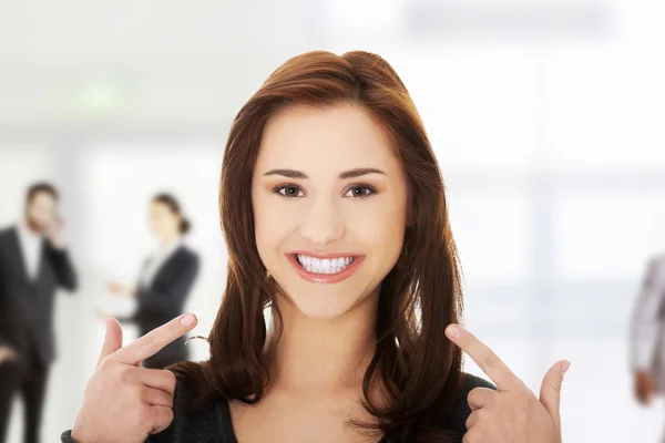 Woman showing teeth — Stock Photo, Image