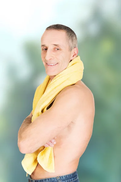 Mature man with a towel around neck — Stock Photo, Image